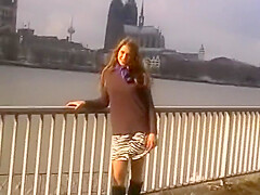 A Sexy Brunette Babe From Germany Gets Her Tits Sprayed In Public