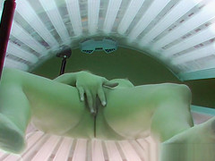 Beautiful Brunette Masturbating in Solarium