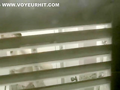 Big shaved pussy spied while peeing