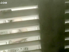 Big shaved pussy spied while peeing