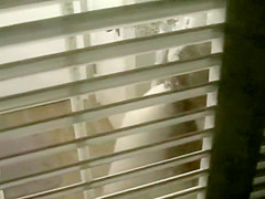 Big shaved pussy spied while peeing