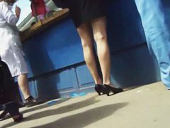 Black hair woman in a blue shirt underskirt video