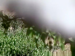 Blonde woman in shorts caught peeing in the nature