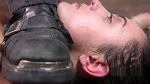 Brunette in spread eagle bondage whipped