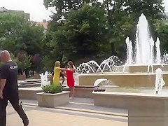 Busty babe walking naked in fountain