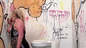 Busty british babe sucking at the gloryhole