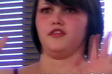 Busty brunette babe smoking nude on the sofa