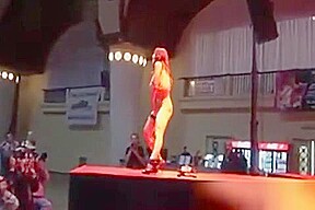 Busty chick stripping in high heels