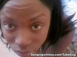Busty ebony babe sucking white cock
