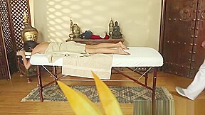 Busty massage babe tugging masseurs dick