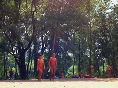 Candid camera rolling on an unsuspecting nudist beach