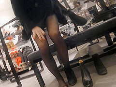 Candid legs in a shoe store