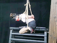 Chinese Model Sitting On A Iron Bar