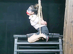 Chinese Model Sitting On A Iron Bar