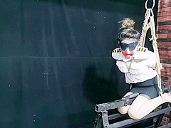 Chinese Model Sitting On A Iron Bar