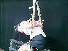 Chinese Model Sitting On A Iron Bar