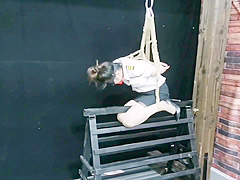 Chinese Model Sitting On A Iron Bar
