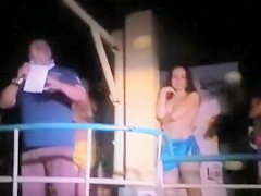 Club dolls dancing topless for the crowd