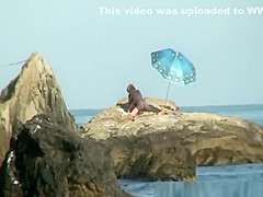 Couple caught fucking in the rocks