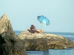 Couple caught fucking in the rocks