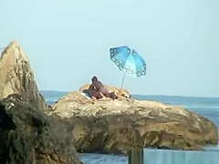 Couple caught fucking in the rocks