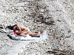 Couple fucked on a public beach while as people walked near