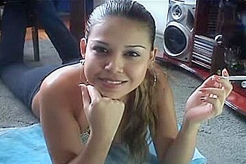 Cute Latina smokes a cigarette on a webcam