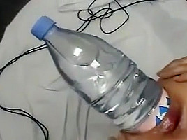 Evian bottle inserted in pussy