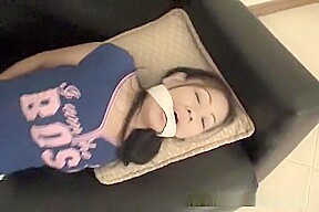 Exquisite Asian babe tied up on a couch