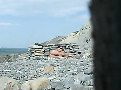Gagging on a plump dong on the beach