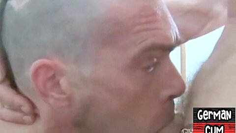 German gay in leather pants assfisted in BJ n fisting 3some