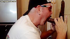 Gloryhole amateur DILF sucking and tugging BBC at home