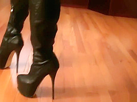 Goddess putting leather boots 1