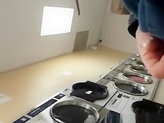 Guy plays with his cock in the laundry place
