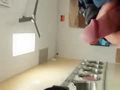 Guy plays with his cock in the laundry place