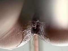 Hairy beaver pissing in closeup