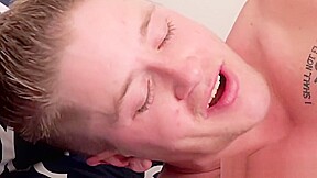 Handsome gay guy strokes his erect cock while ass fucked