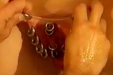Heavily pierced milf is fisted