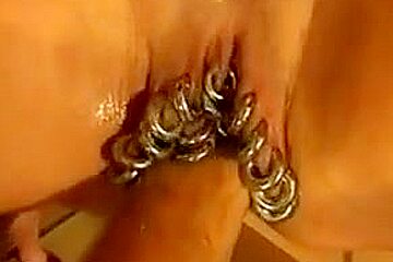 Heavily pierced milf is fisted