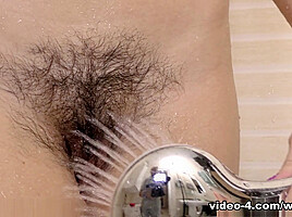 Helga enjoys a shower and masturbates to orgasm