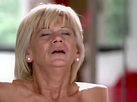 Horny granny enjoys riding and sucking big young dick