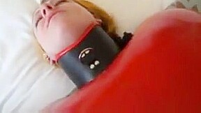 Inflatable red latex sack and gagged mouth