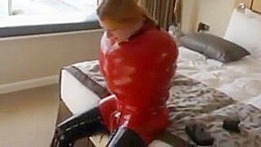 Inflatable red latex sack and gagged mouth