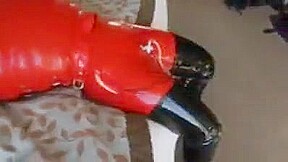 Inflatable red latex sack and gagged mouth