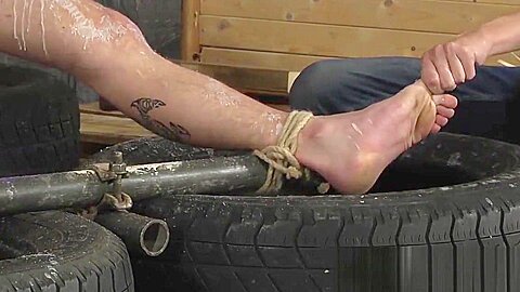 Kinky Ashton working on tied up sub twink Michael