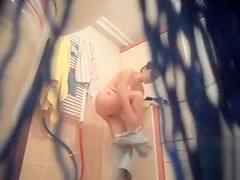 Large-breasted wife gets naked and takes a shower