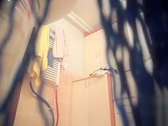 Large-breasted wife gets naked and takes a shower