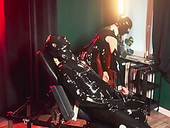 Latex Slave With Rubber Finest Mask Receives Blowjob