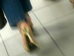 MILF in golden high heels