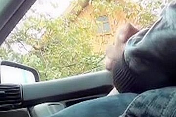 Man sitting in the car giving the view on his hard cock